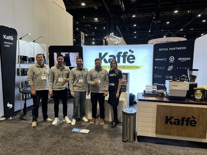The Kaffe team at their trade show booth listing retail partners